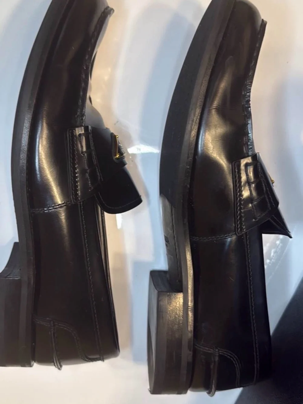 Prada Black Leather Men's Slip-On Loafers with Gold Logo